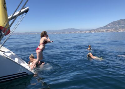 People enjoying a boat tour and a refreshing swim in the open sea in Benalmádena